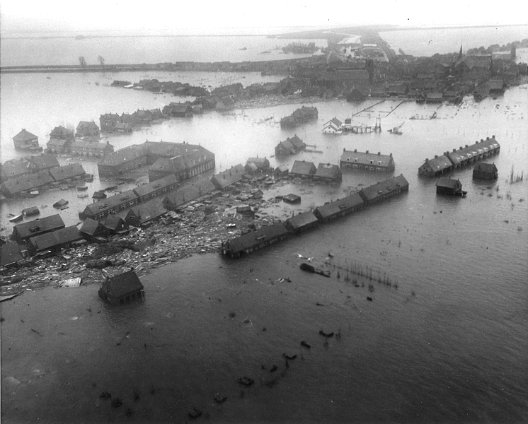 Public Domain (English: Netherlands. Viewed from a U.S. Army helicopter, a Zuid Beveland town gives a hint of the tremendous damage wrought by the flood to Dutch islands - 1953)
